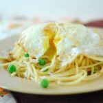 fried egg over pasta