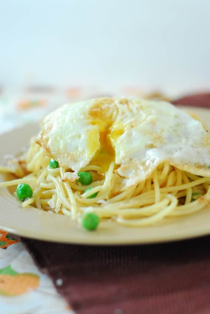 fried egg over pasta